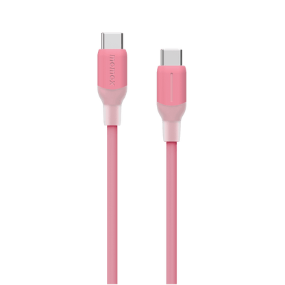 Pink charging cable with connectors on a green background