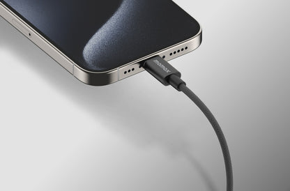 A black 60w USB-C to USB-C cable with triple braided nylon design and premium aluminum housing, attached to a phone displayed on a white background.