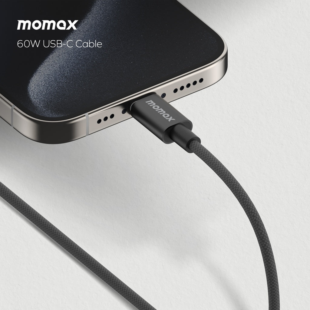 A black 60w USB-C to USB-C cable with triple braided nylon design and premium aluminum housing, attached to a phone displayed on a white background.