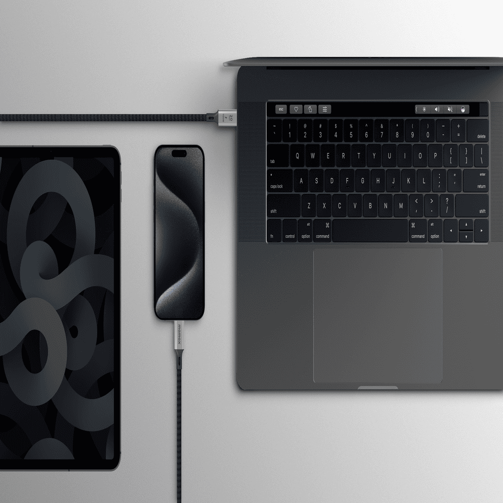 Laptop, smartphone, and tablet on a light gray surface