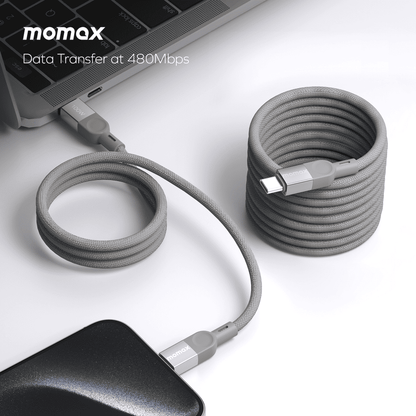 Gray USB cable with connectors on a white surface, featuring the Momax brand.