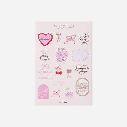 Sheet of pink temporary tattoos with various designs on a white background