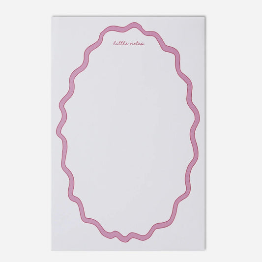 Notepad with pink decorative border on a white background
