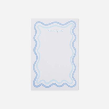 Notepad with wavy blue border and text on a white background
