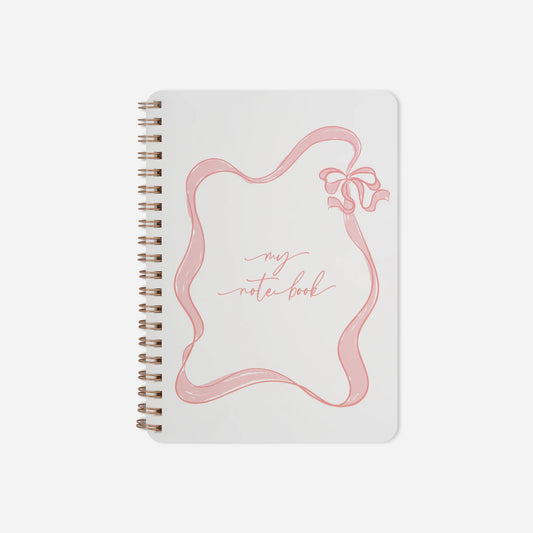 Notebook with pink design and 'my notebook' text on a white background