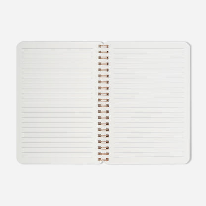 Open notebook with lined pages on a white background