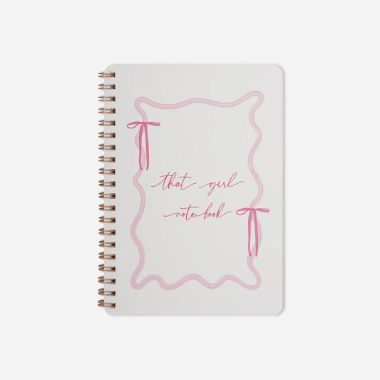 Notebook with pink design and text on a white background