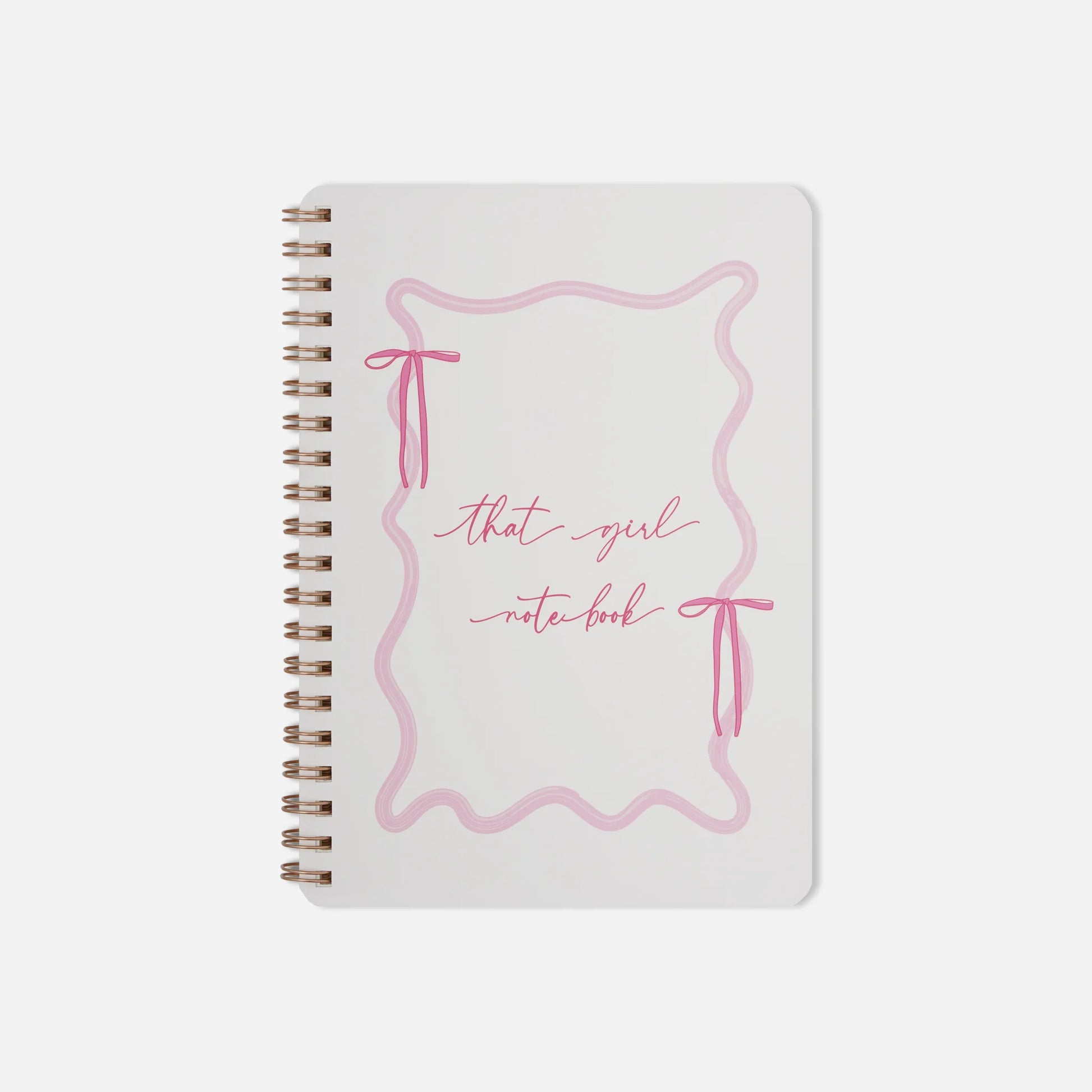 Notebook with pink design and text on a white background