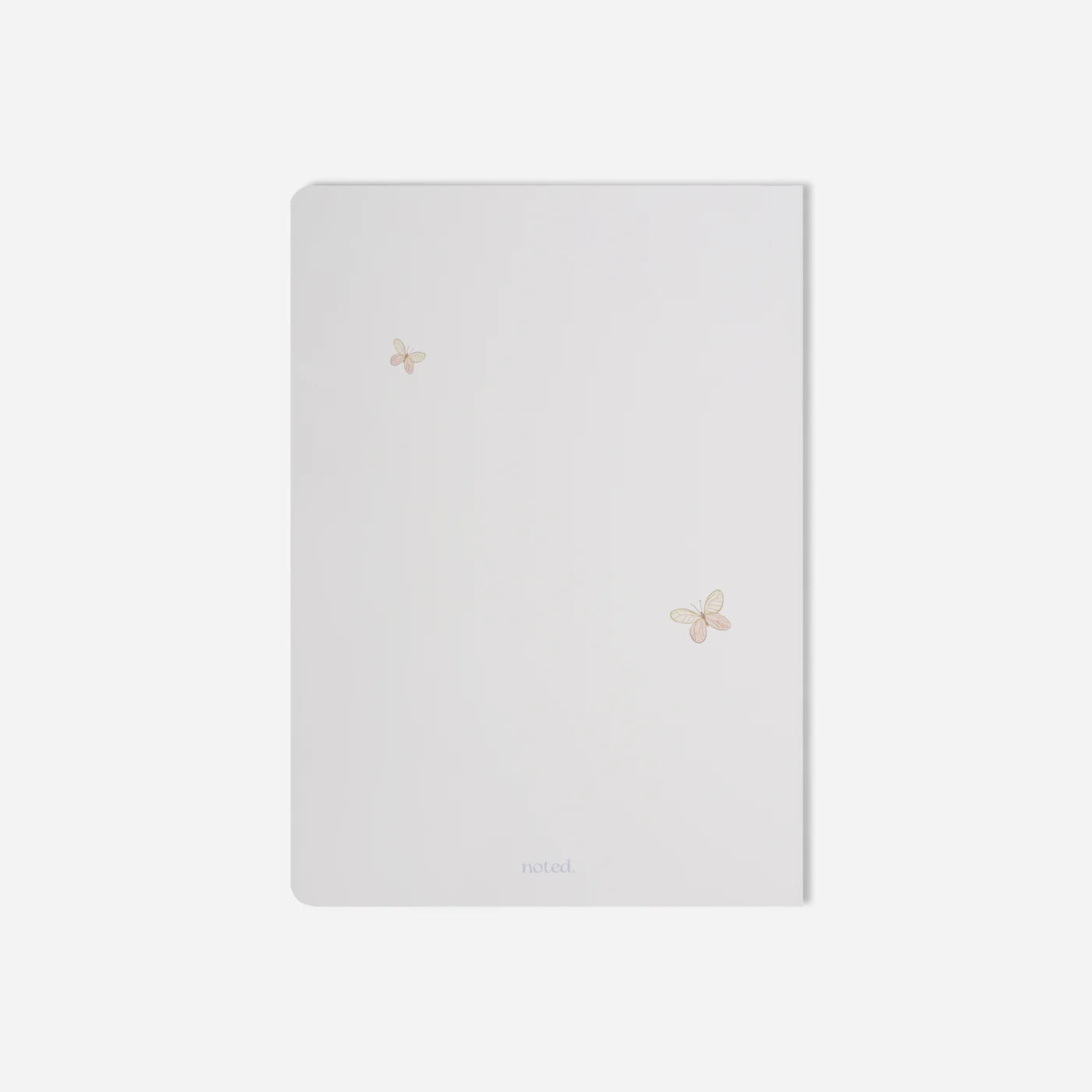White notebook with floral designs on a light gray background