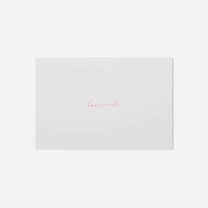 White paper with 'loves note' text on a white background