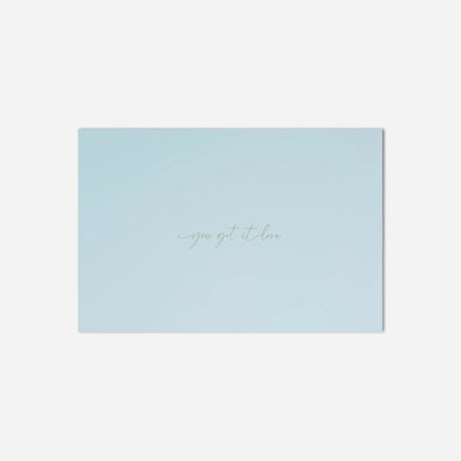 Light blue card with 'you got it' text on a white background