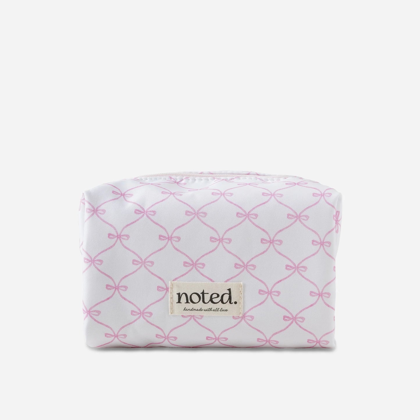 White pouch with pink bow pattern and 'noted' brand label on a white background