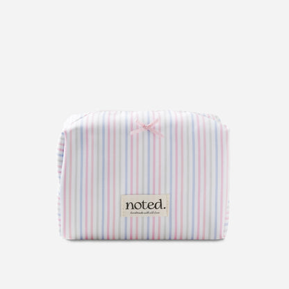 Striped pouch with 'noted' label on a white background
