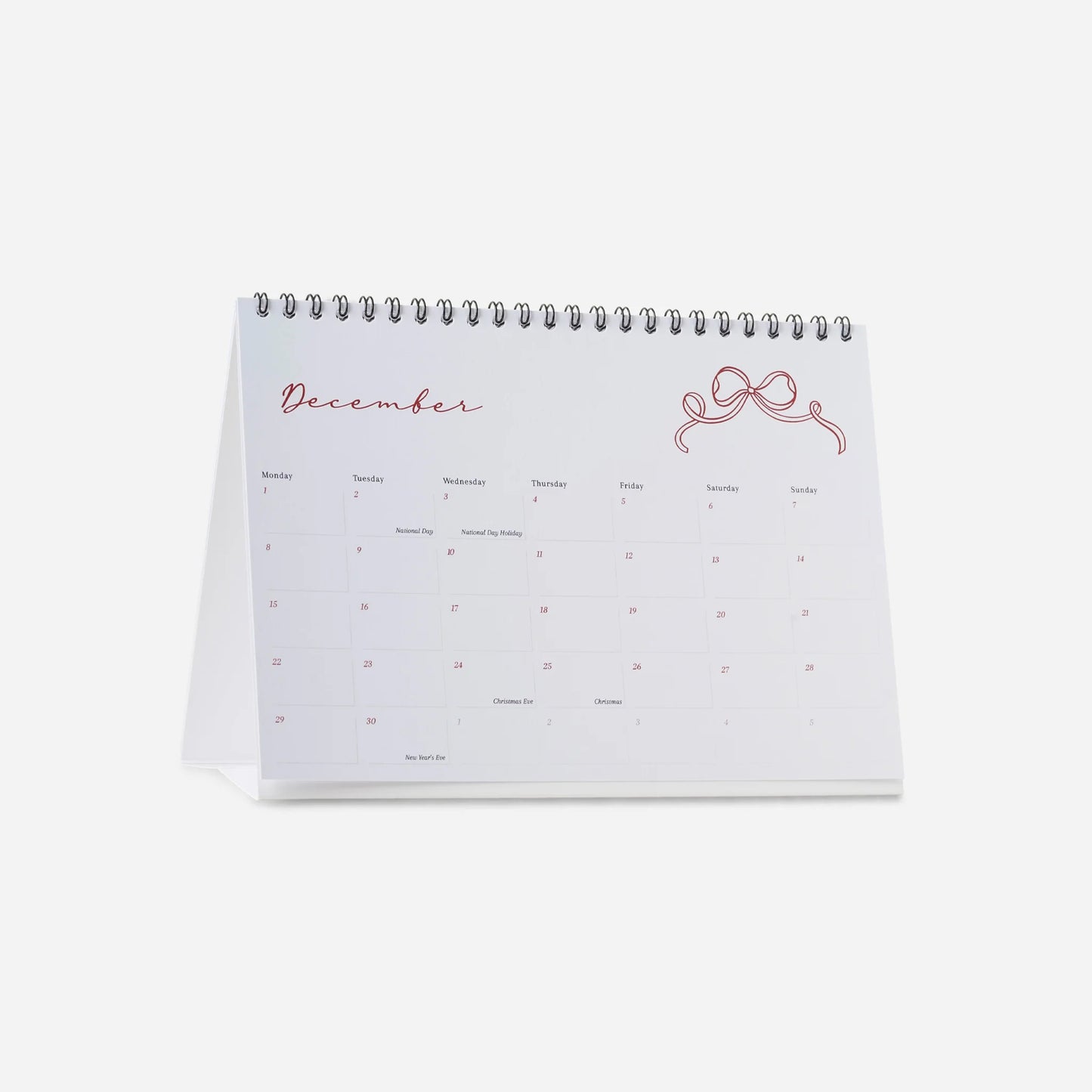 Calendar open to December on a white background
