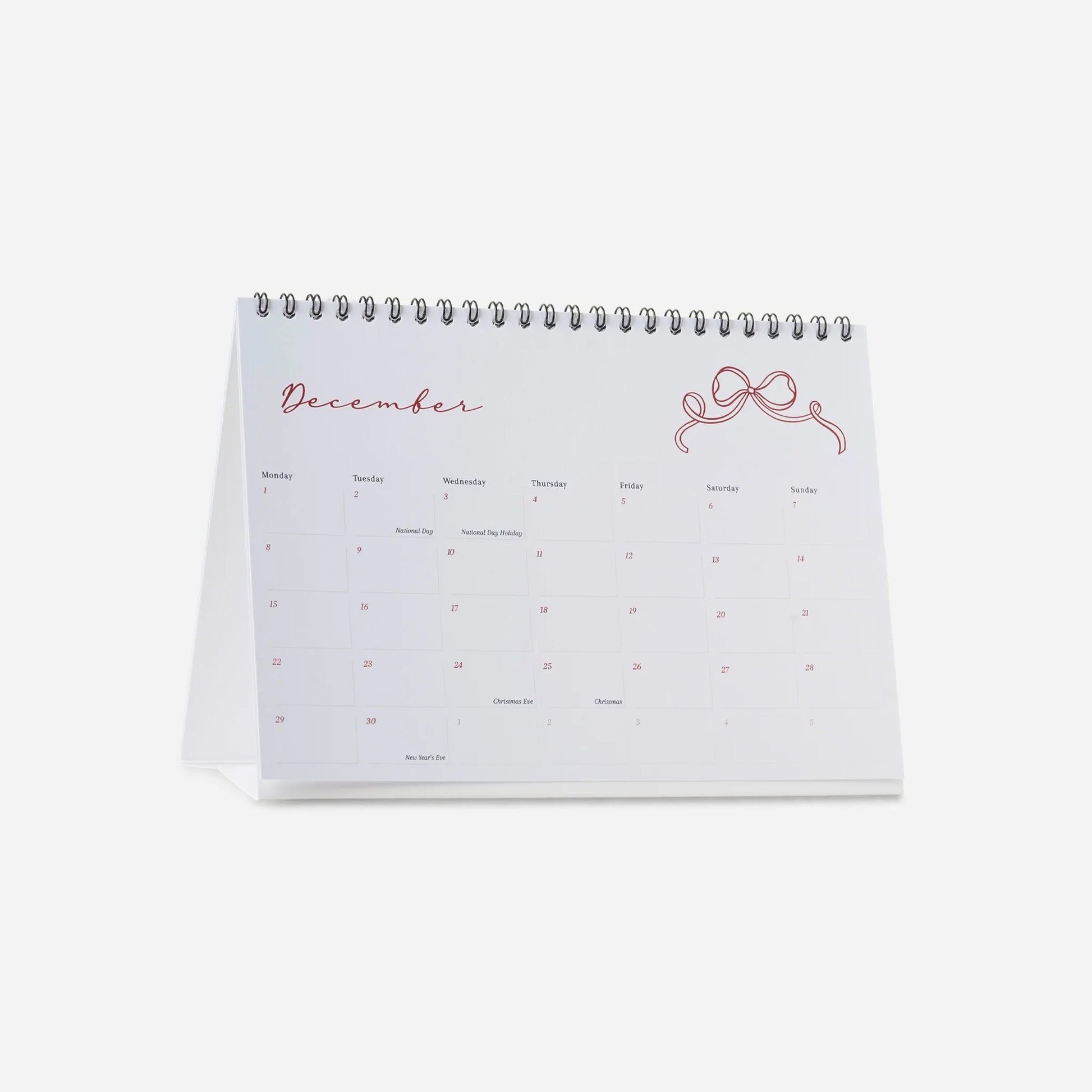 Calendar open to December on a white background