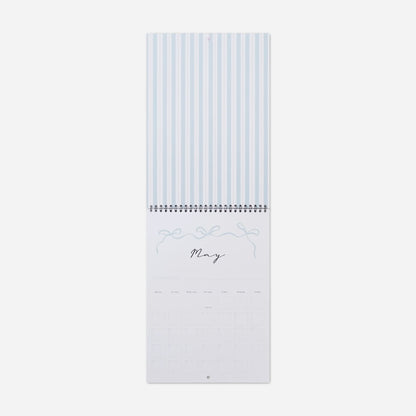 Calendar with blue striped design on a white background