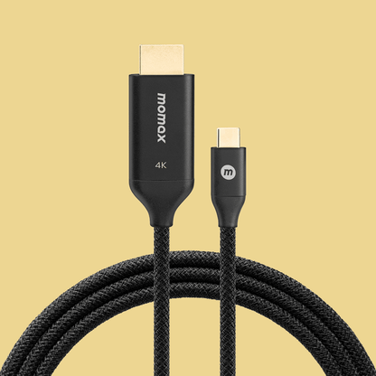 HDMI cable with gold connectors on a beige background
