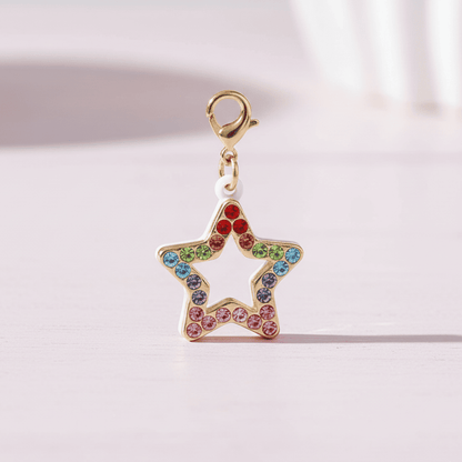 Star-shaped charm with colorful gemstones on a light pink background