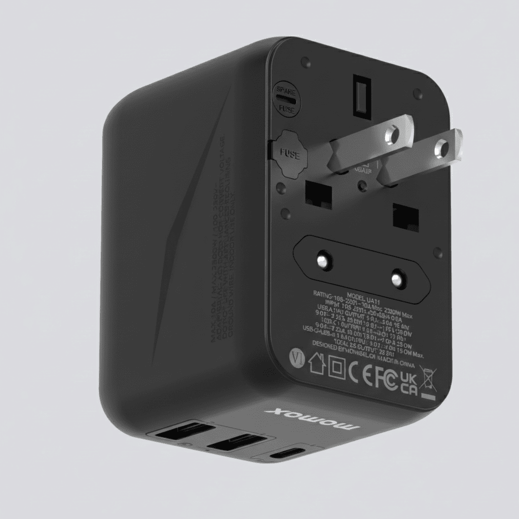 Black travel adapter with multiple ports on a light gray background