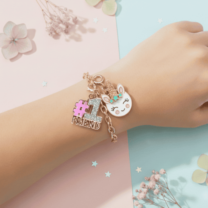 Bracelet with charms on a child's wrist against a pastel background