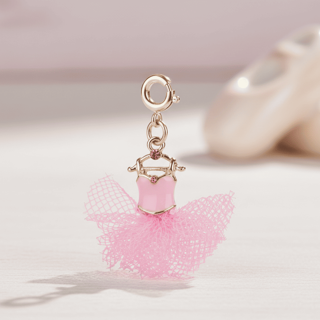 Pink ballerina charm on a light pink background