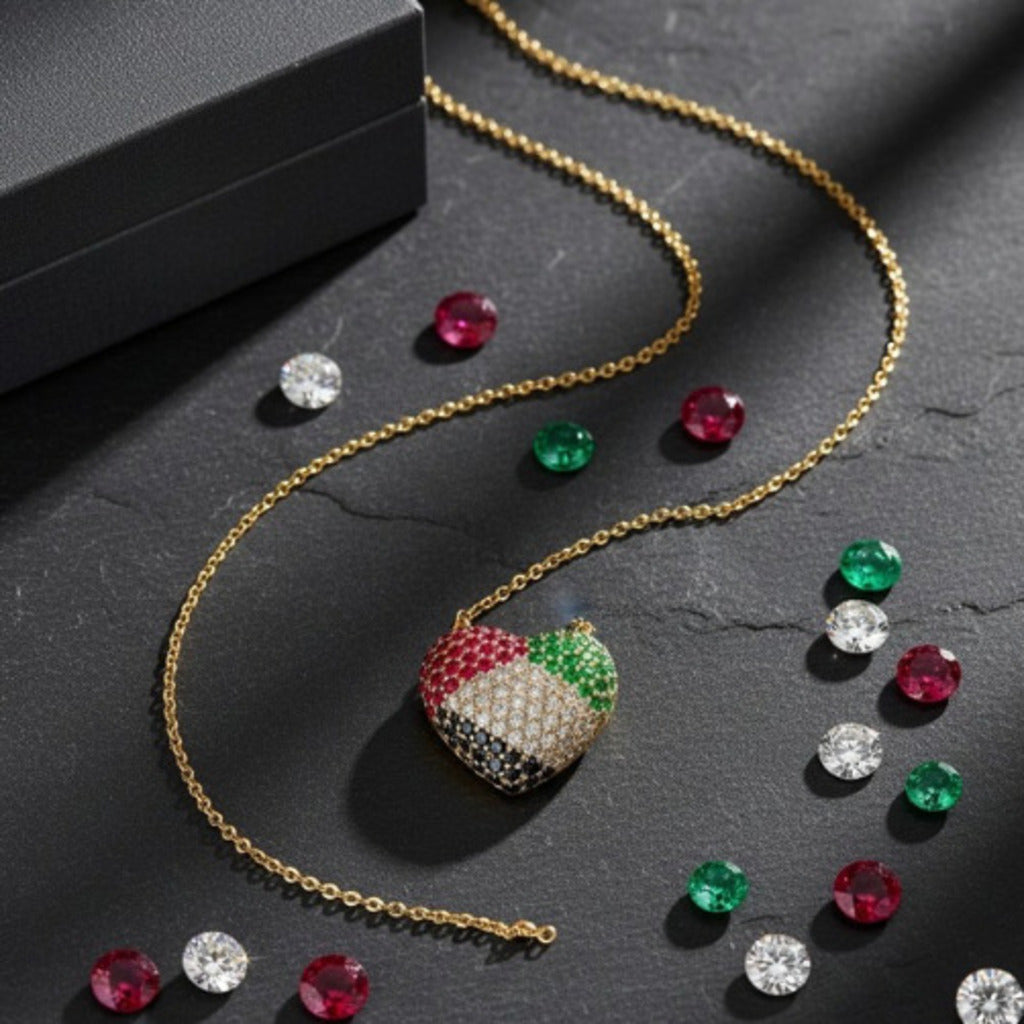 Gold necklace with colorful pendant and scattered gemstones on a dark surface