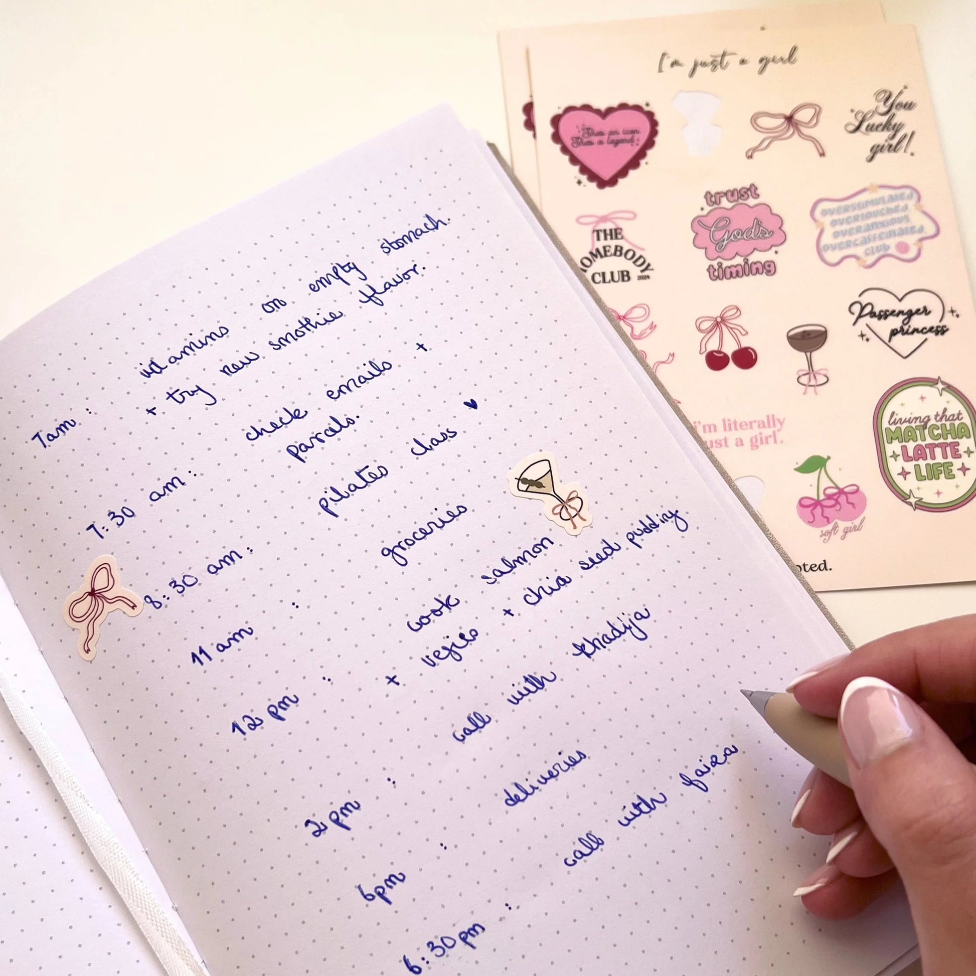 Handwritten notes on a notebook with decorative stickers