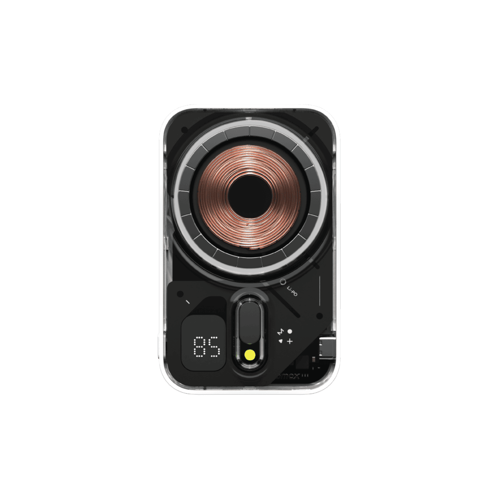 Close-up of a speaker with a metallic cone on a green background