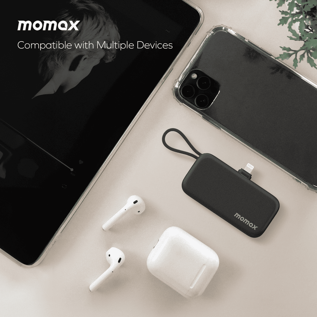 momax portable charger with phone, tablet, and AirPods on a light surface