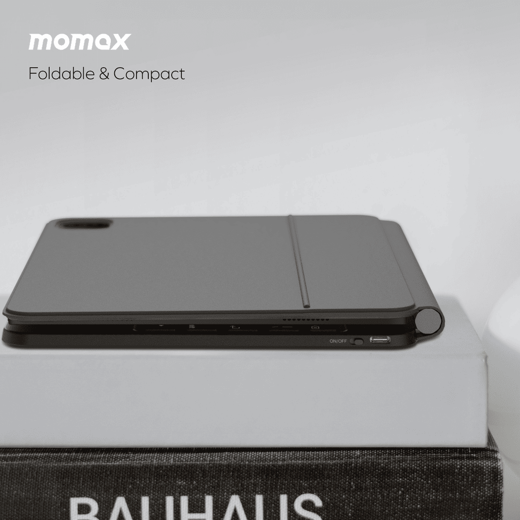 Momax foldable and compact product on a light gray background