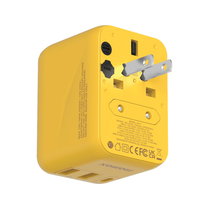Yellow travel adapter with multiple plug sockets on a transparent background