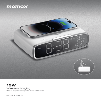 Momax clock with wireless charging pad and smartphone on a gray background
