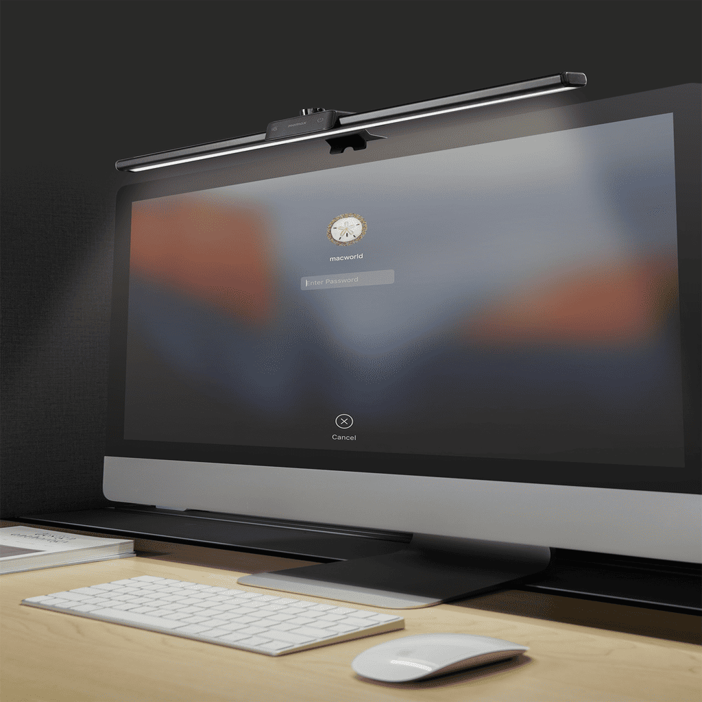 Computer monitor with keyboard and mouse on a desk, illuminated by a screen protector.