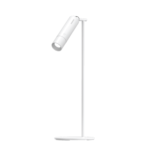 White adjustable desk lamp on a green background
