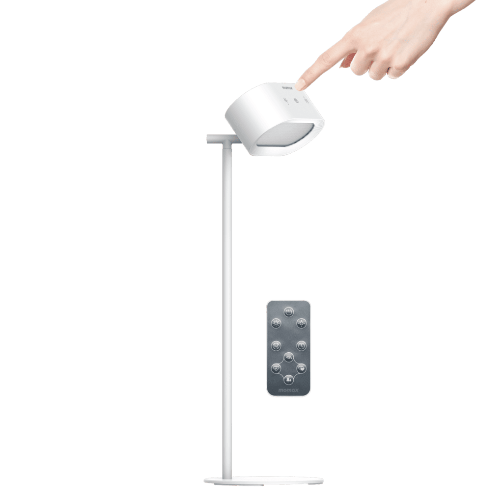 White adjustable desk lamp with remote control on a green background