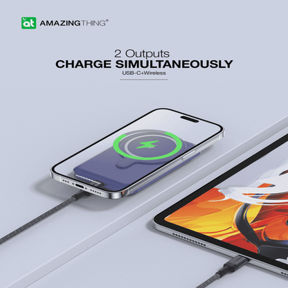 Phone with wireless charging cable on a light gray background, featuring 'Amazing Thing' branding.