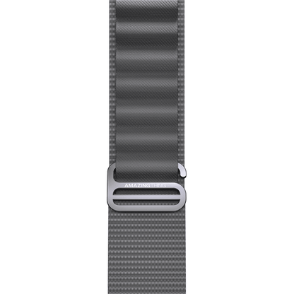 Gray watch strap with metal buckle on a white background