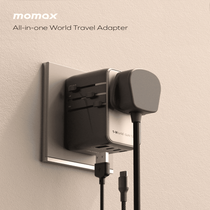 Momax all-in-one world travel adapter on a beige background