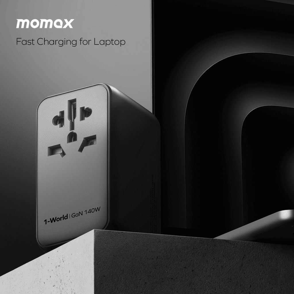 Momax fast charging adapter for laptop on a dark background