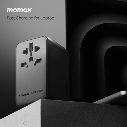 Momax fast charging adapter for laptop on a dark background