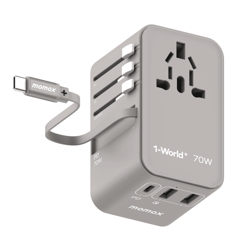 Gray travel adapter with multiple ports and a cable on a green background