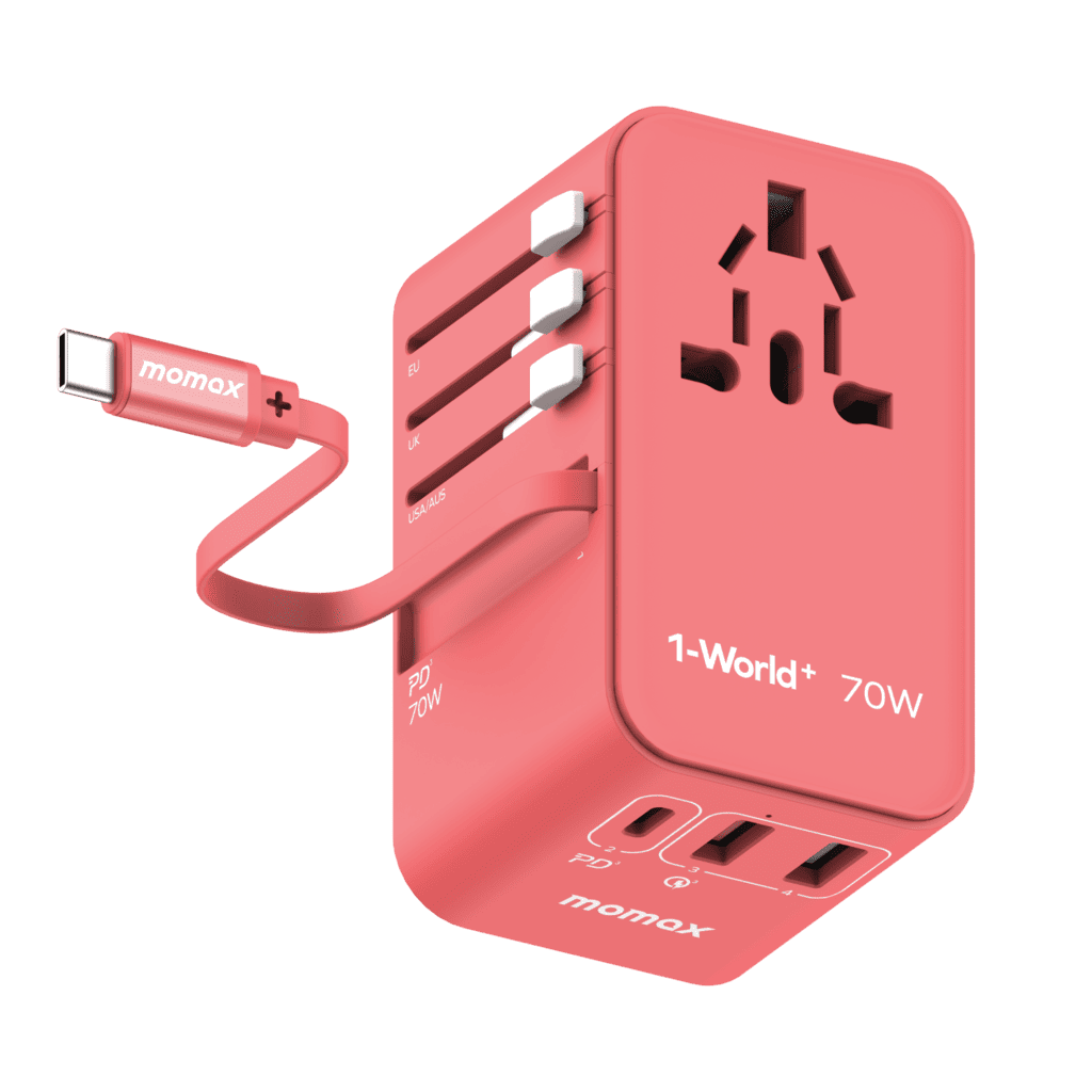 Red travel adapter with multiple ports and a cable on a green background