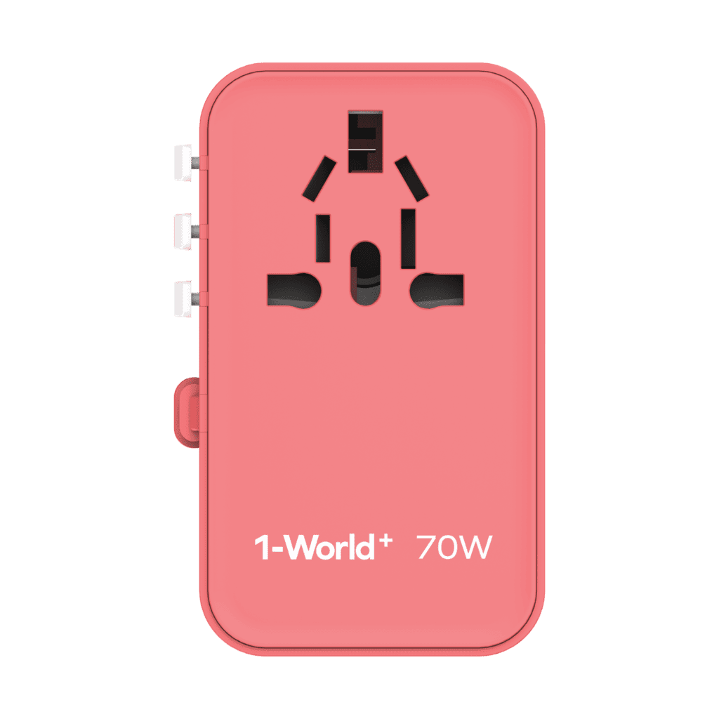 Pink travel adapter with '1-World+' branding on a green background