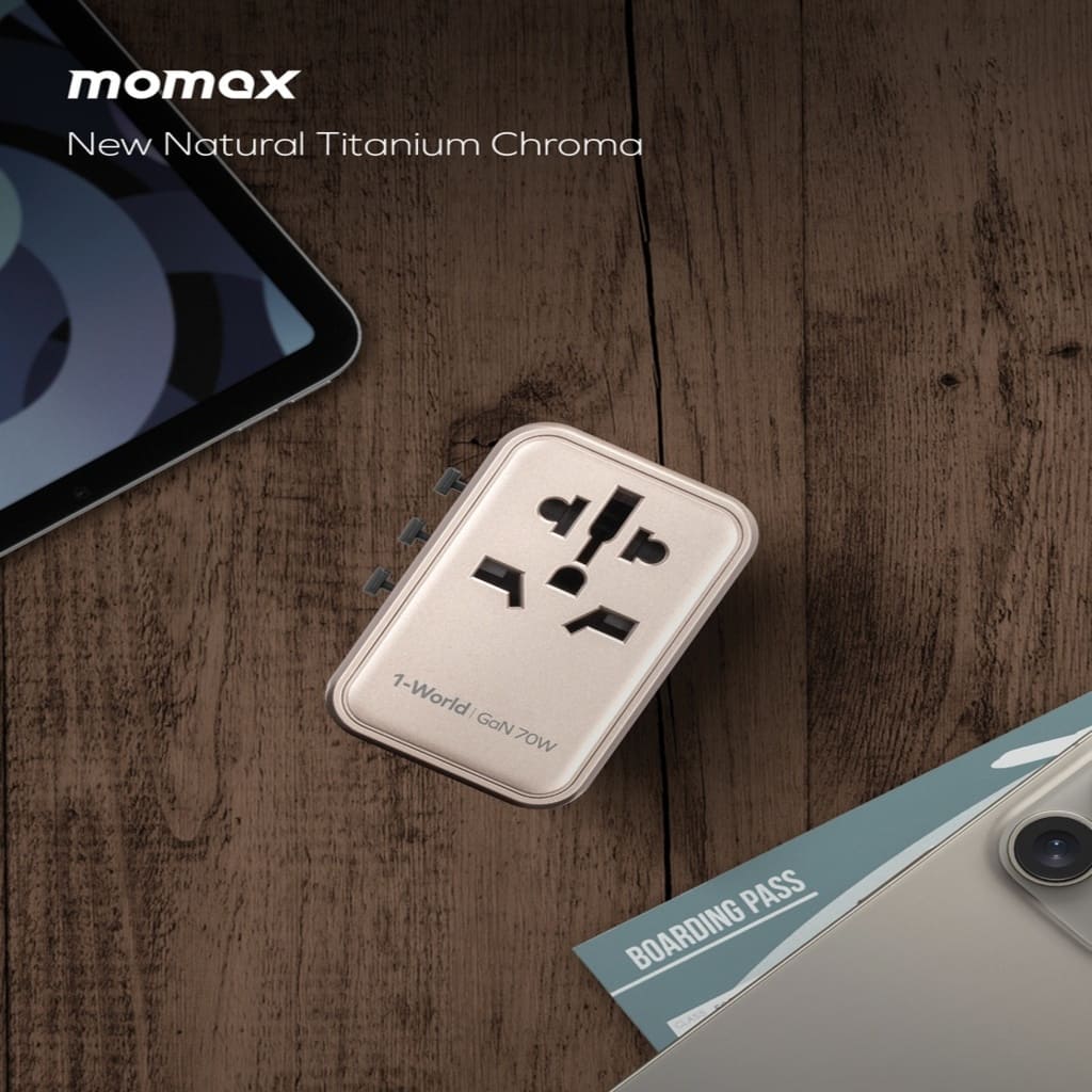 Power adapter on a wooden surface with 'momax' branding