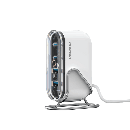 White USB hub with multiple ports on a green background