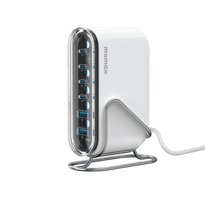 White USB hub with multiple ports on a green background