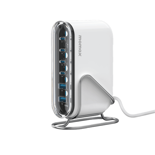 White USB hub with multiple ports on a green background