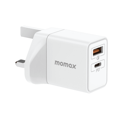 White power adapter with USB-C and USB-A ports on a green background