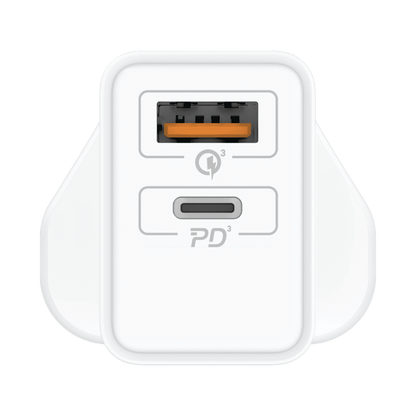 White power adapter with USB-C and USB-A ports on a green background