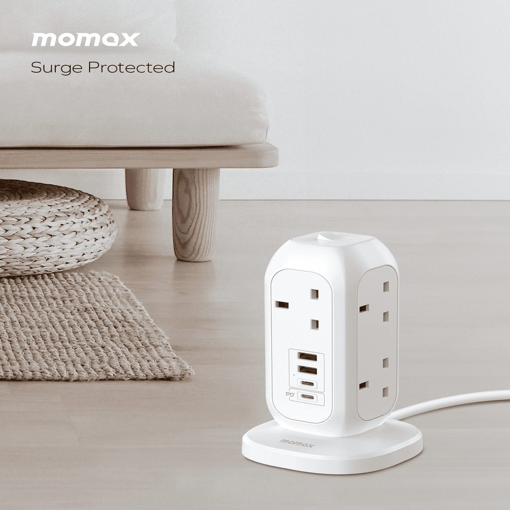 Momax surge protected power strip on a light wooden floor with a neutral background